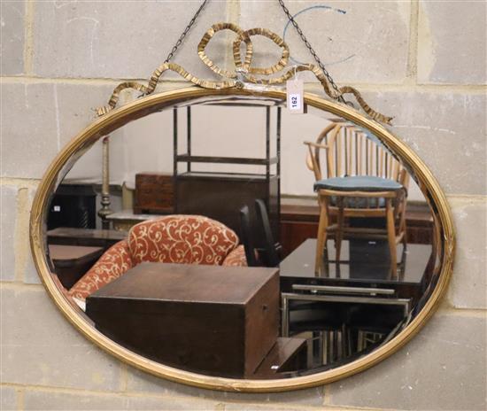 An Edwardian oval giltwood and gesso wall mirror (a.f.), W.92cm, H.76cm